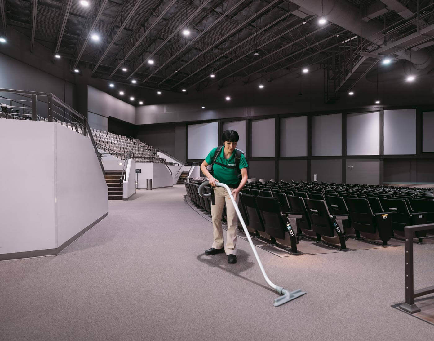 professional vacuuming of auditorium seating for corporate events venue