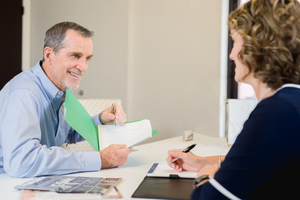 commercial cleaning company presenting documents to business owner