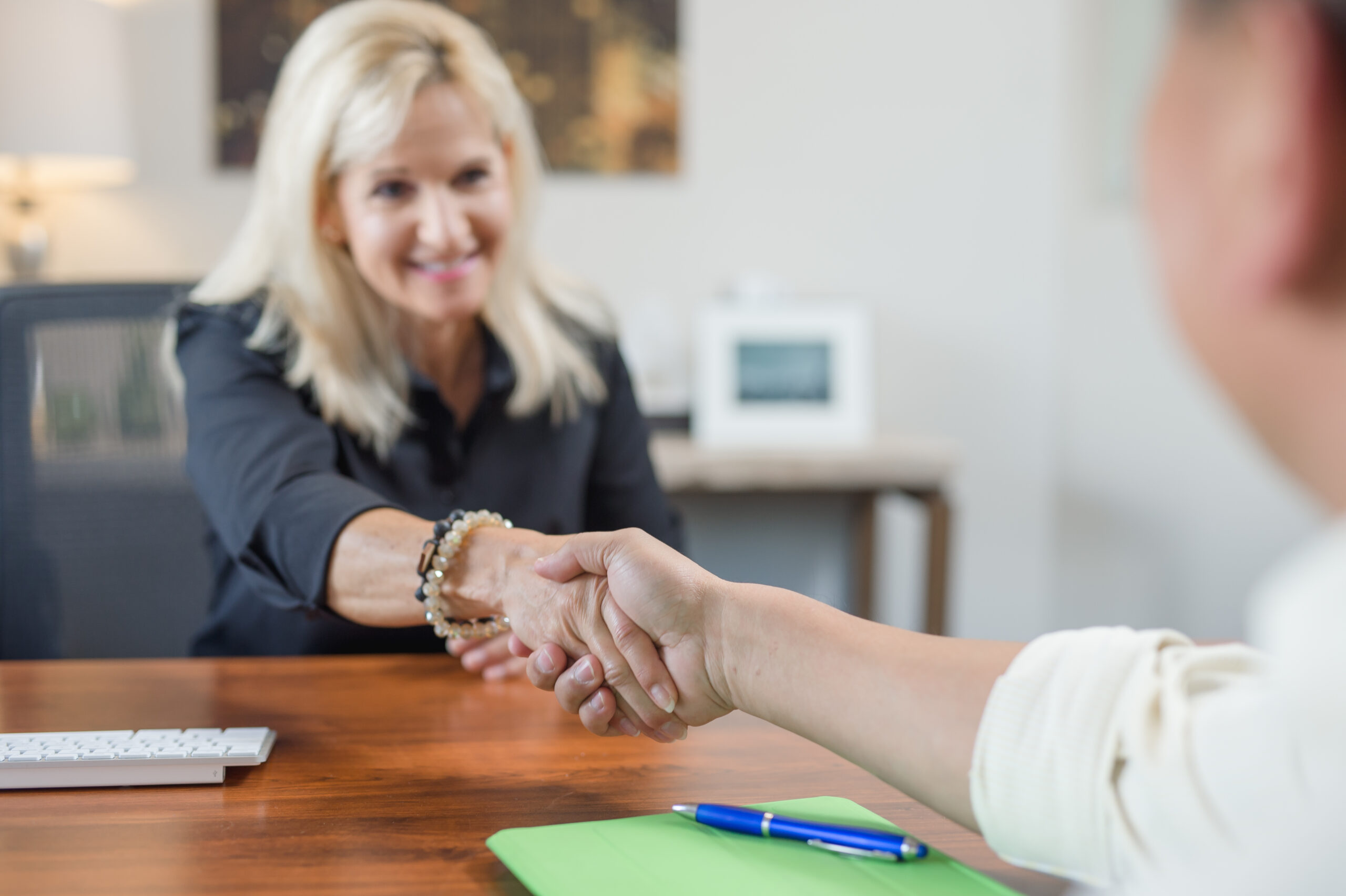 business owner shaking hands in agreement with commercial cleaning company