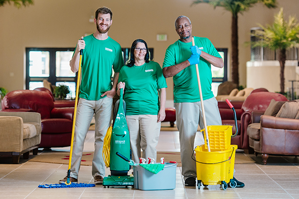 Janitorial team ready to clean corporate office