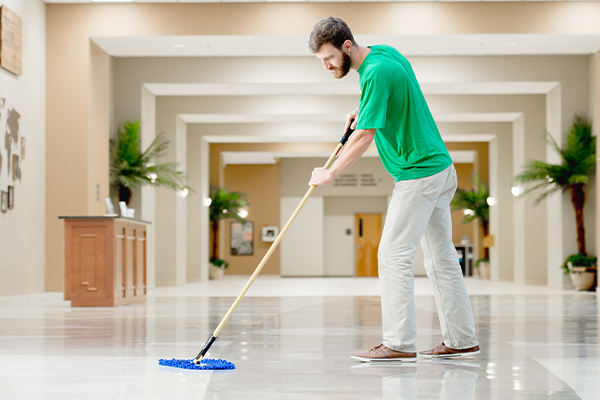 Corporate building lobby floor being mopped