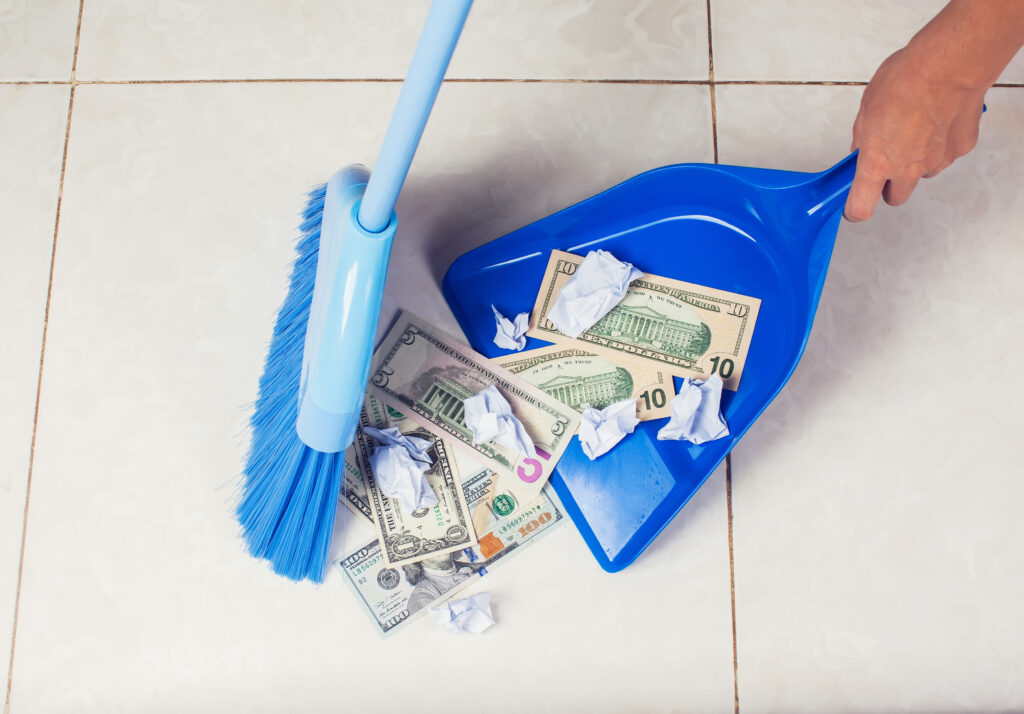 money and paper work being swept into tray