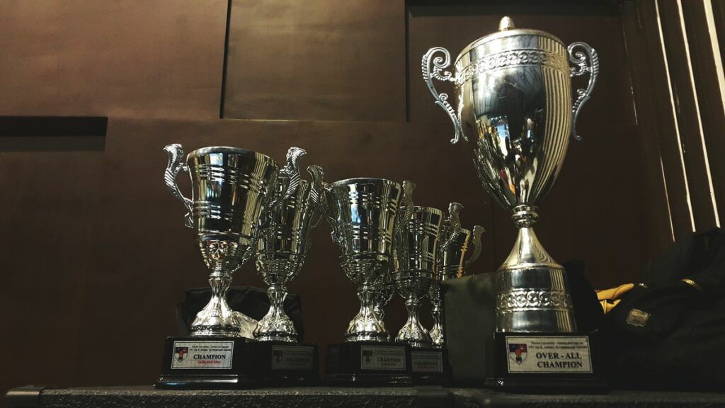 Row of trophies on table