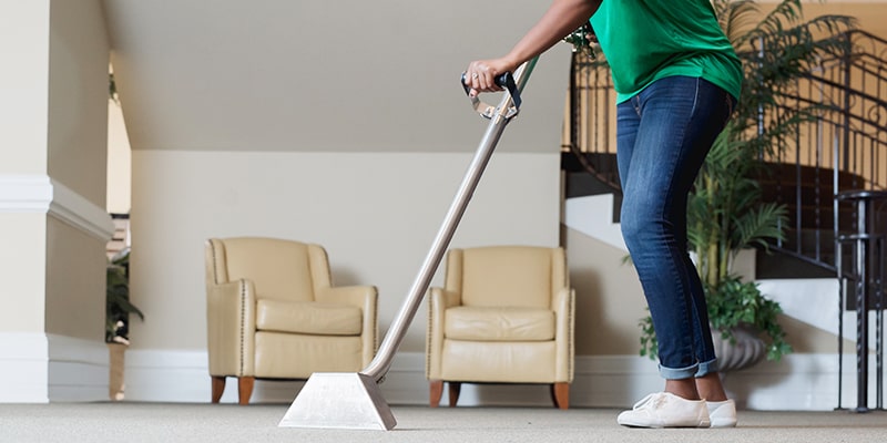 professional carpet cleaner cleaning a lobby area