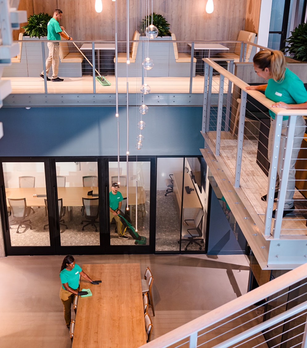 Office Pride commercial cleaning team working inside a commercial facility