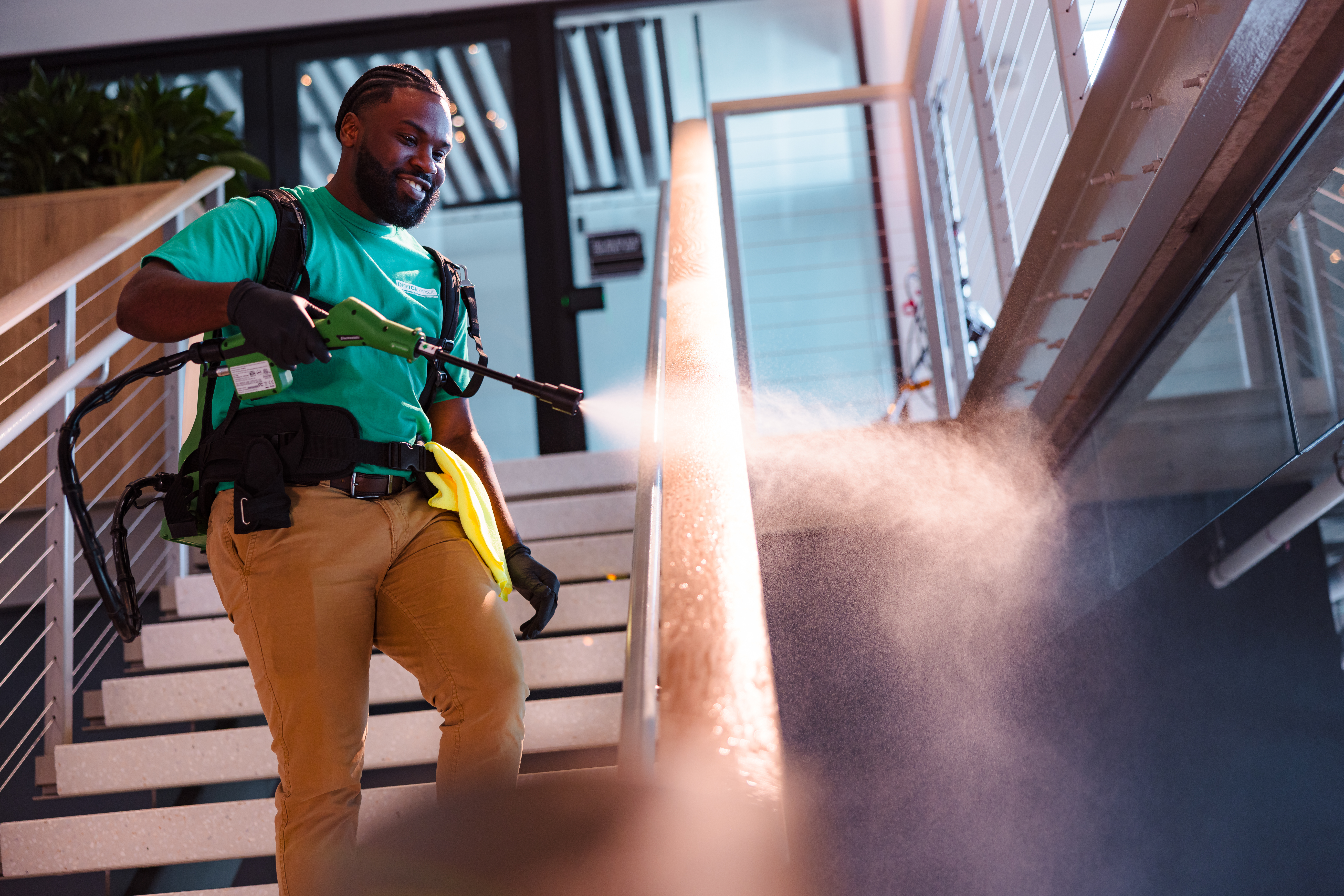 Office Pride professional cleaning a modern commercial building during a detailed service visit