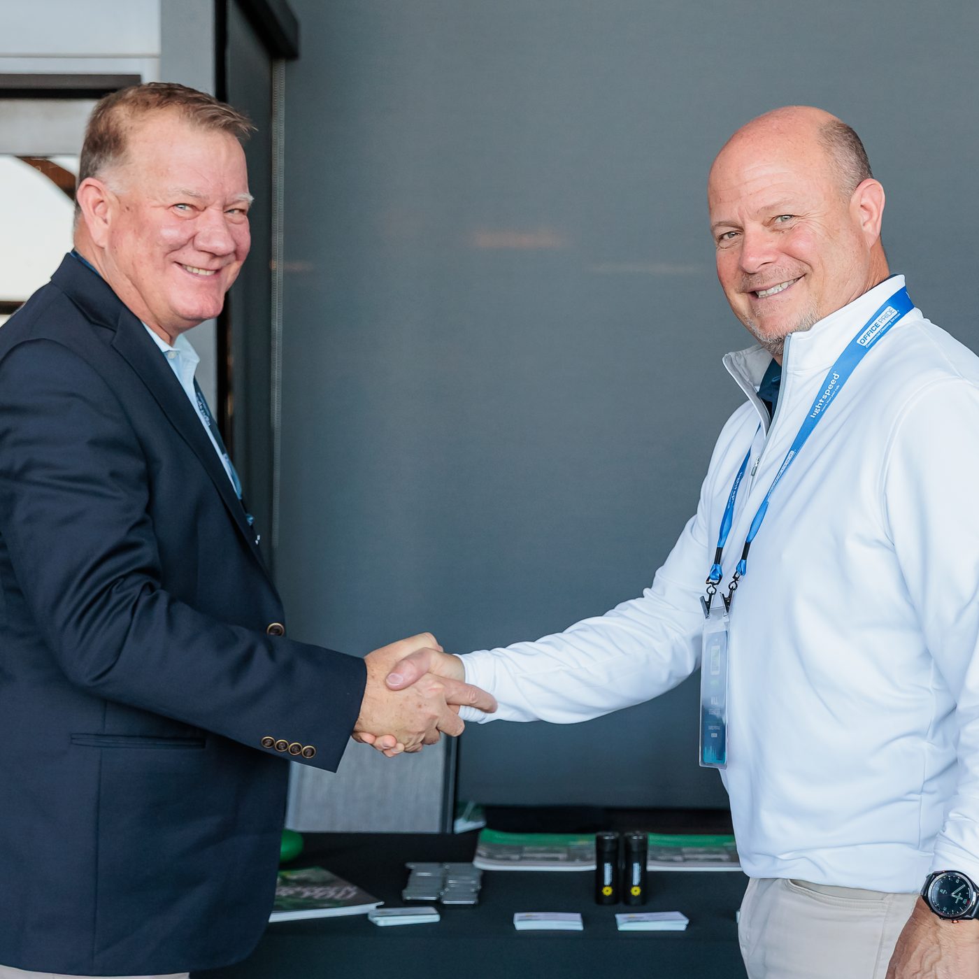 An Office Pride franchise owner shaking hands with a supplier partner